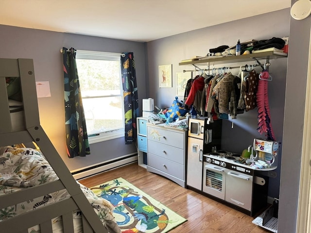 interior space featuring light hardwood / wood-style floors and baseboard heating