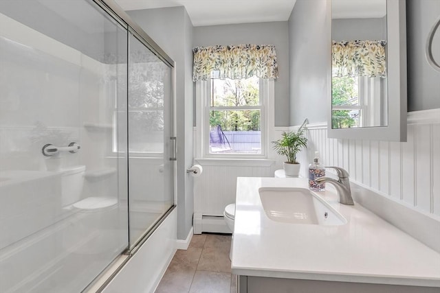 10 Briarcliff Ln, Paxton, MA 01612 - bathroom with baseboard heating, a shower with shower door, toilet, vanity, and wainscoting