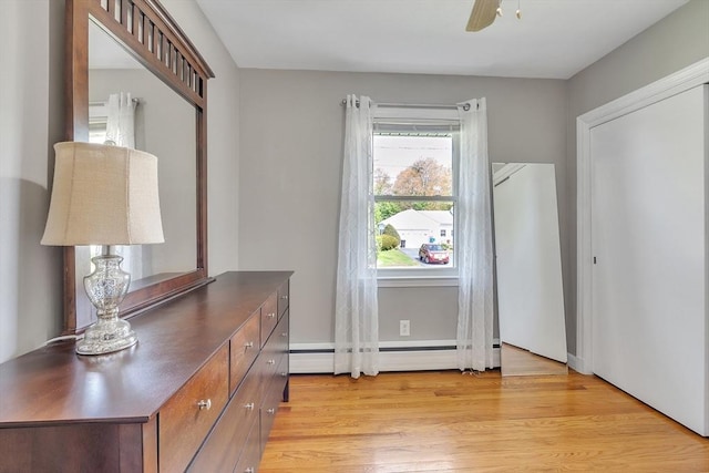 10 Briarcliff Ln, Paxton, MA 01612 - bedroom featuring baseboard heating, light wood-style flooring, and a ceiling fan