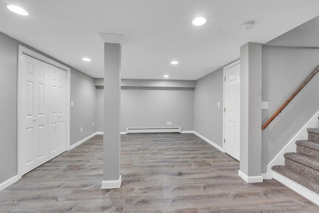 10 Briarcliff Ln, Paxton, MA 01612 - finished basement featuring baseboard heating, wood finished floors, baseboards, recessed lighting, and stairway