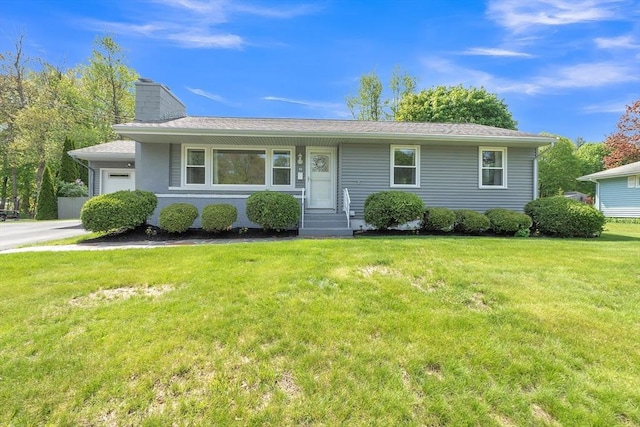 10 Briarcliff Ln, Paxton, MA 01612 - view of front of house featuring a chimney, a front yard, and a garage