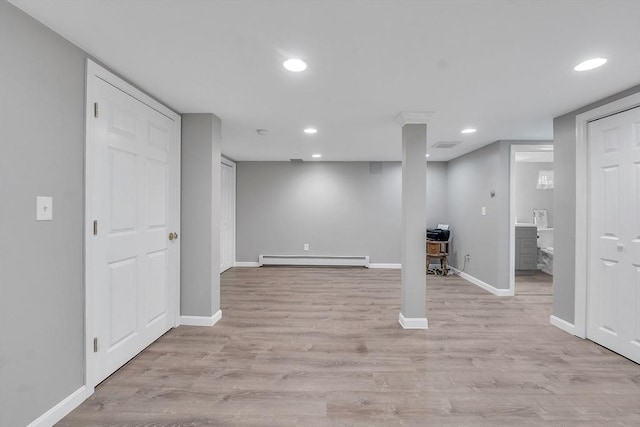 10 Briarcliff Ln, Paxton, MA 01612 - finished basement with a baseboard heating unit, baseboards, light wood-type flooring, and recessed lighting