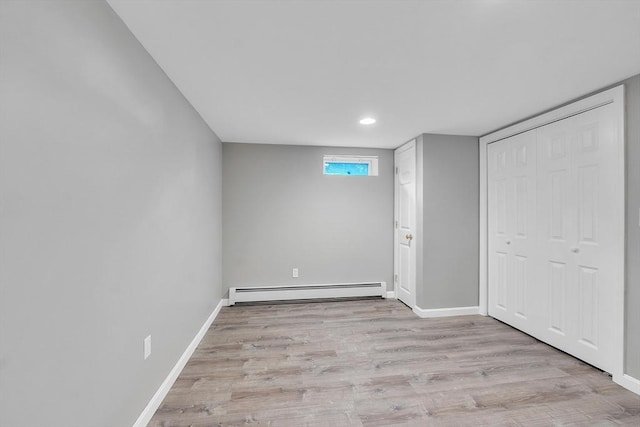 10 Briarcliff Ln, Paxton, MA 01612 - unfurnished bedroom with a baseboard radiator, wood finished floors, baseboards, a closet, and recessed lighting