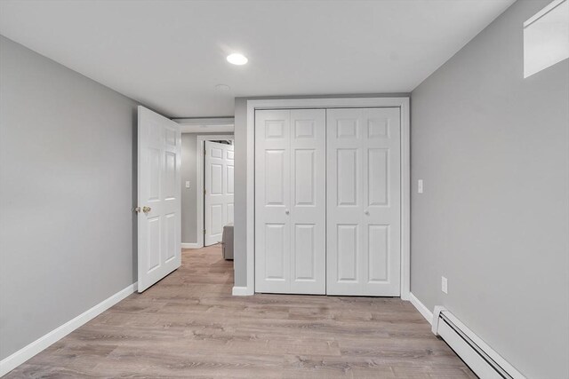 10 Briarcliff Ln, Paxton, MA 01612 - unfurnished bedroom featuring baseboard heating, light wood finished floors, baseboards, and recessed lighting