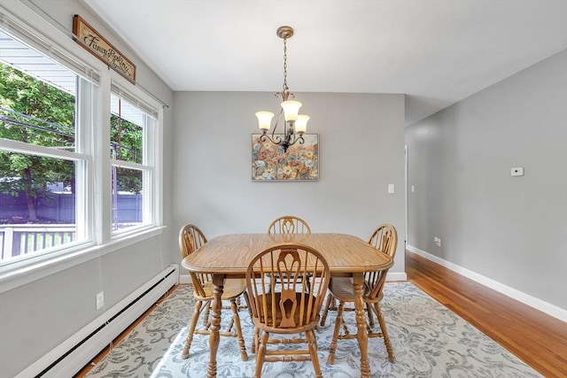 10 Briarcliff Ln, Paxton, MA 01612 - dining area featuring a baseboard radiator, a chandelier, wood finished floors, and baseboards