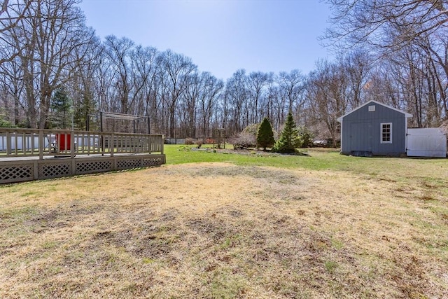 view of yard with an outbuilding and a deck