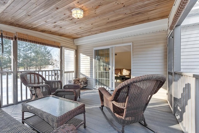 sunroom featuring wood ceiling