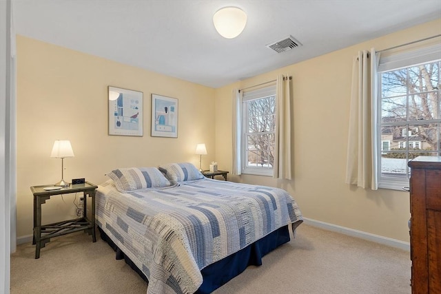 bedroom featuring light colored carpet