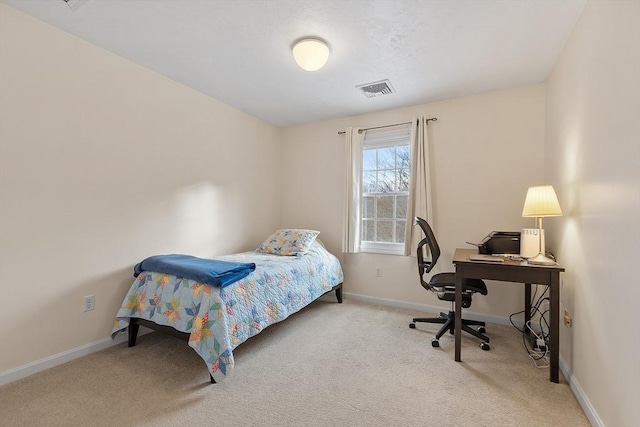 bedroom featuring light carpet