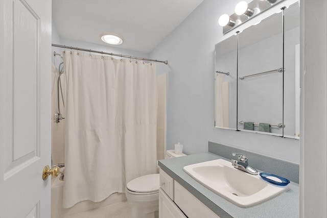 bathroom with vanity, toilet, and curtained shower