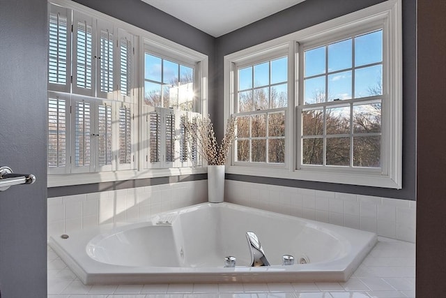 bathroom featuring a relaxing tiled tub