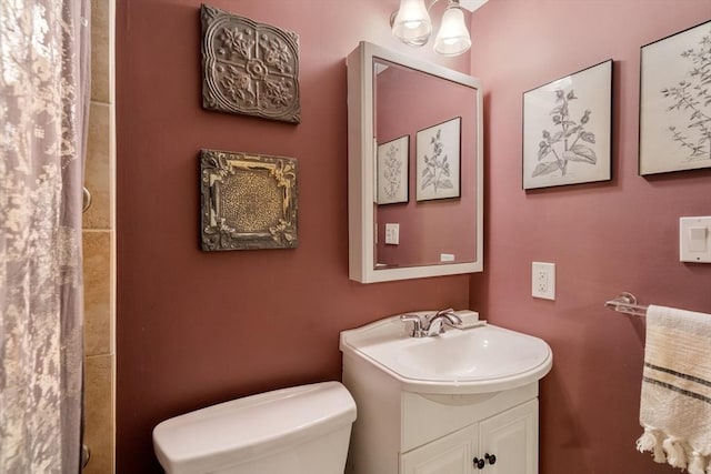 bathroom with vanity and toilet