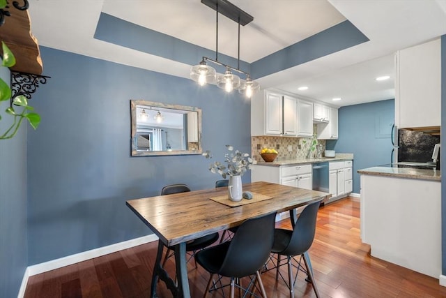 dining space featuring hardwood / wood-style flooring