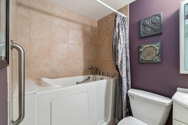 full bathroom featuring independent shower and bath, vanity, and toilet