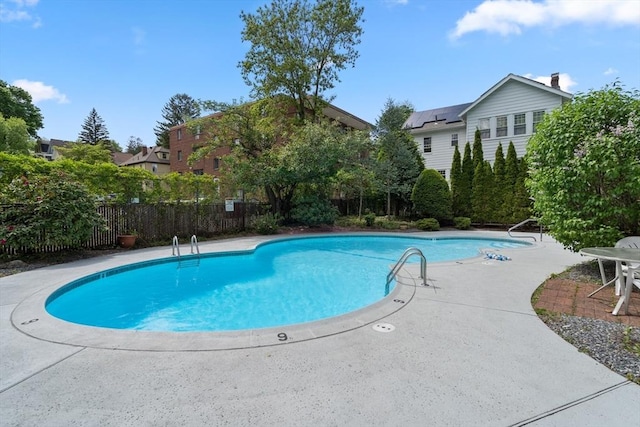 view of swimming pool with a patio area