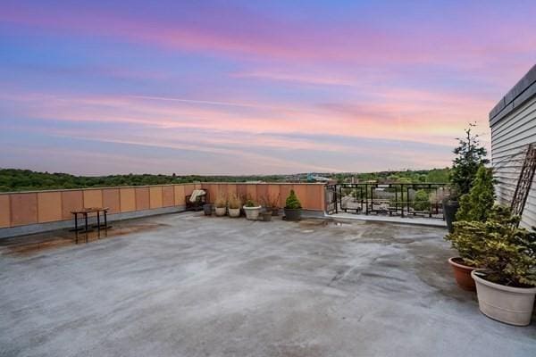 view of patio terrace at dusk