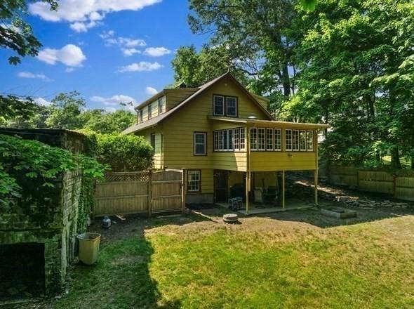 50 Grove Hill Park, Newton, MA 02460 - rear view of house featuring fence, a yard, and a deck