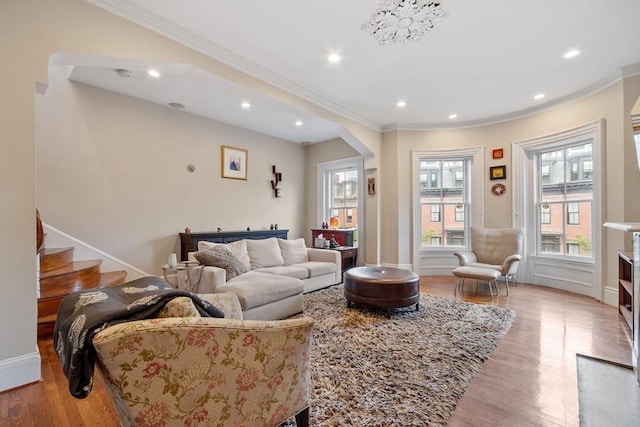 38 Concord Sq Unit 2, Boston, MA 02118 - living room featuring wood finished floors, crown molding, recessed lighting, arched walkways, and stairway