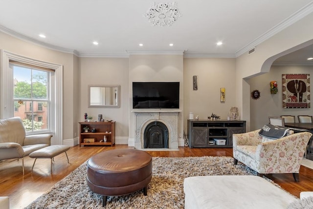 38 Concord Sq Unit 2, Boston, MA 02118 - living area featuring wood finished floors, crown molding, recessed lighting, and a fireplace with flush hearth