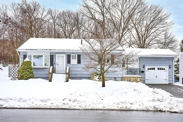 single story home featuring a garage