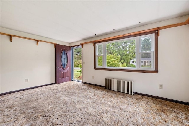 61 Mattawa Cir, Orange, MA 01364 - entryway featuring radiator heating unit, healthy amount of natural light, and carpet