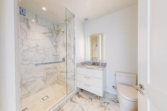 bathroom featuring visible vents, vanity, toilet, marble finish floor, and a marble finish shower
