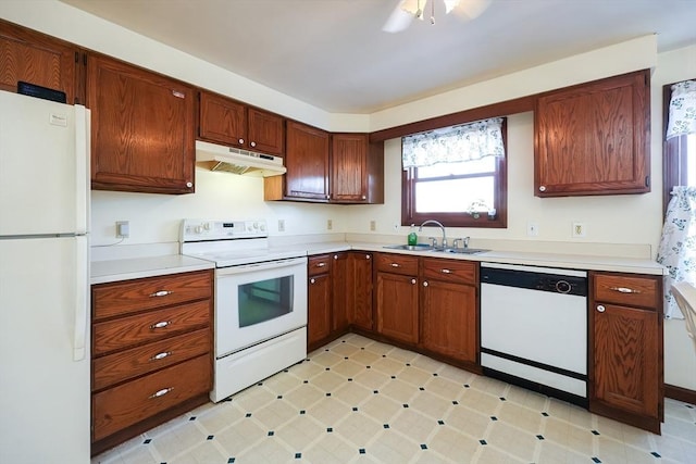 kitchen with sink and white appliances