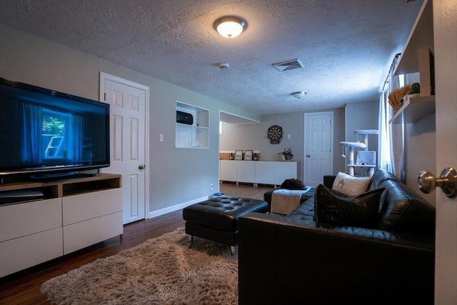 796 Foundry St, Easton, MA 02375 - living room with a textured ceiling, wood finished floors, and built in features