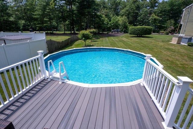 796 Foundry St, Easton, MA 02375 - view of swimming pool with a wooden deck, a fenced backyard, and view of scattered trees