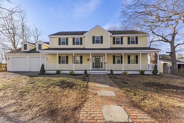 view of front of house with covered porch and a garage