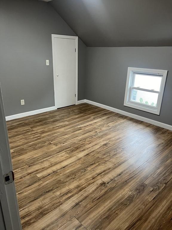 422 County St, Fall River, MA 02723 - additional living space with lofted ceiling, dark wood finished floors, and baseboards