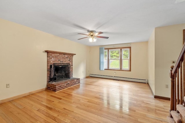 71 Johnny Appleseed Ln, Leominster, MA 01453 - unfurnished living room with baseboard heating, ceiling fan, light wood-type flooring, and a fireplace