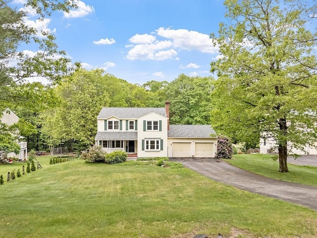 71 Johnny Appleseed Ln, Leominster, MA 01453 - traditional-style home featuring covered porch, a garage, driveway, and a front yard