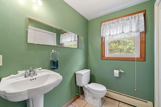 71 Johnny Appleseed Ln, Leominster, MA 01453 - half bath featuring baseboard heating, tile patterned flooring, toilet, a sink, and baseboards