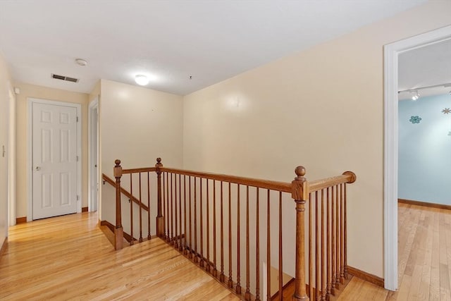 71 Johnny Appleseed Ln, Leominster, MA 01453 - hall with an upstairs landing, light wood finished floors, and baseboards