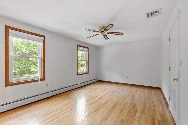 71 Johnny Appleseed Ln, Leominster, MA 01453 - spare room featuring a baseboard heating unit, light wood-type flooring, a ceiling fan, and baseboards