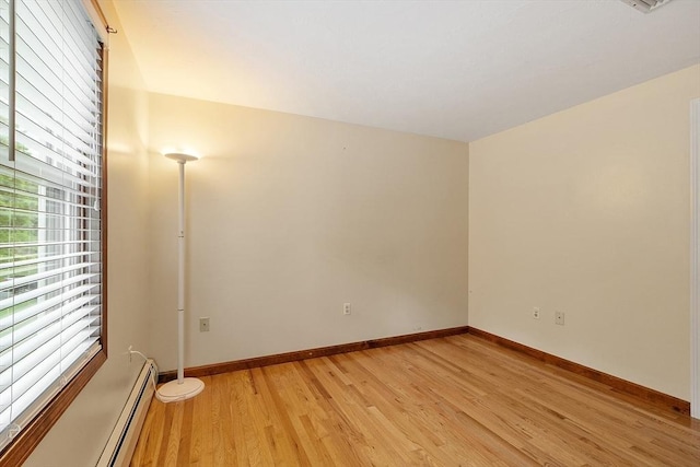 71 Johnny Appleseed Ln, Leominster, MA 01453 - empty room with light wood-style flooring, baseboards, and baseboard heating