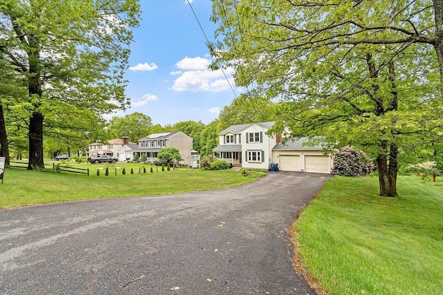 71 Johnny Appleseed Ln, Leominster, MA 01453 - colonial house featuring driveway and a front yard