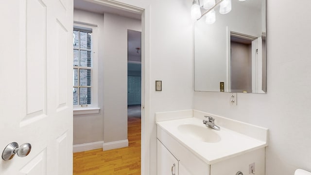 bathroom with vanity and hardwood / wood-style flooring