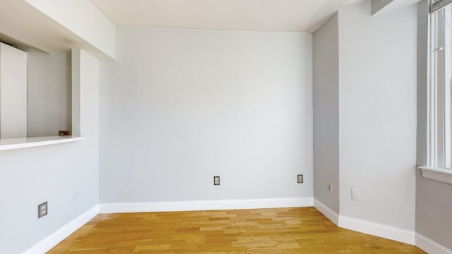 spare room with light hardwood / wood-style floors