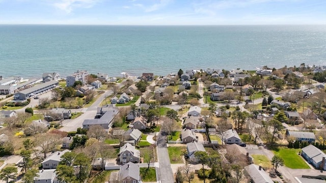 aerial view of property and surrounding area with nearby suburban area and a nearby body of water