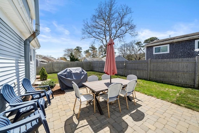 view of patio / terrace with outdoor dining space and a grill
