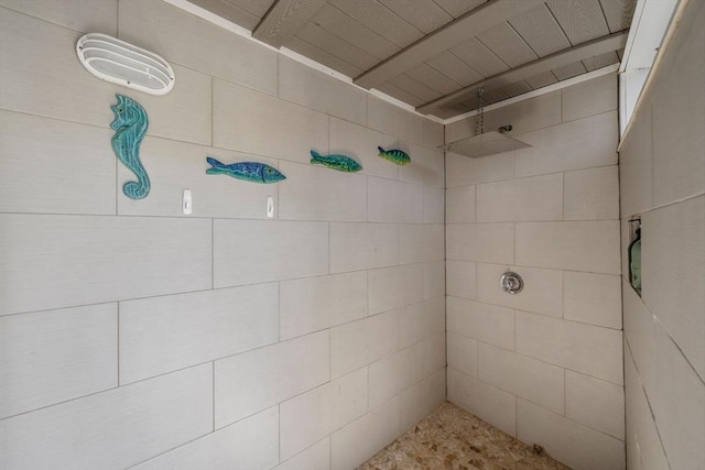 bathroom with tiled shower