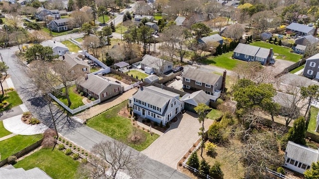 aerial view of property and surrounding area featuring nearby suburban area