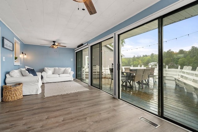 11 Hamilton Dr, Holland, MA 01521 - sunroom with a ceiling fan and outdoor dining area