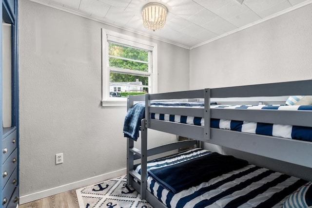 11 Hamilton Dr, Holland, MA 01521 - bedroom featuring ornamental molding, baseboards, wood finished floors, and a chandelier