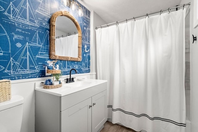 11 Hamilton Dr, Holland, MA 01521 - bathroom with vanity, toilet, wallpapered walls, and a shower with shower curtain