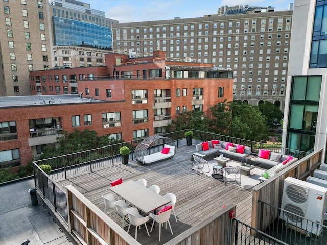 view of property featuring ac unit and an outdoor fire pit