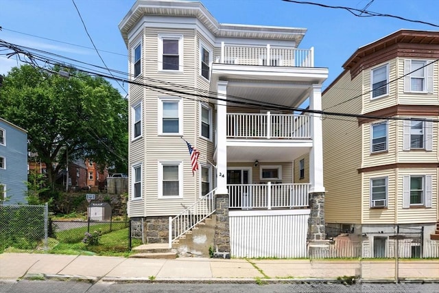 view of front of home featuring a balcony