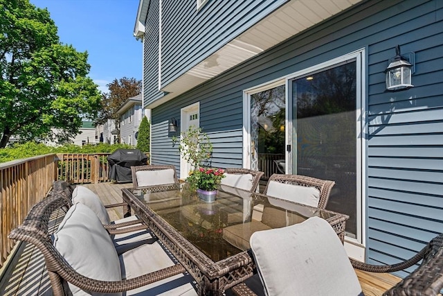 10 Brickett Ave, Haverhill, MA 01830 - wooden deck with outdoor dining space and a grill